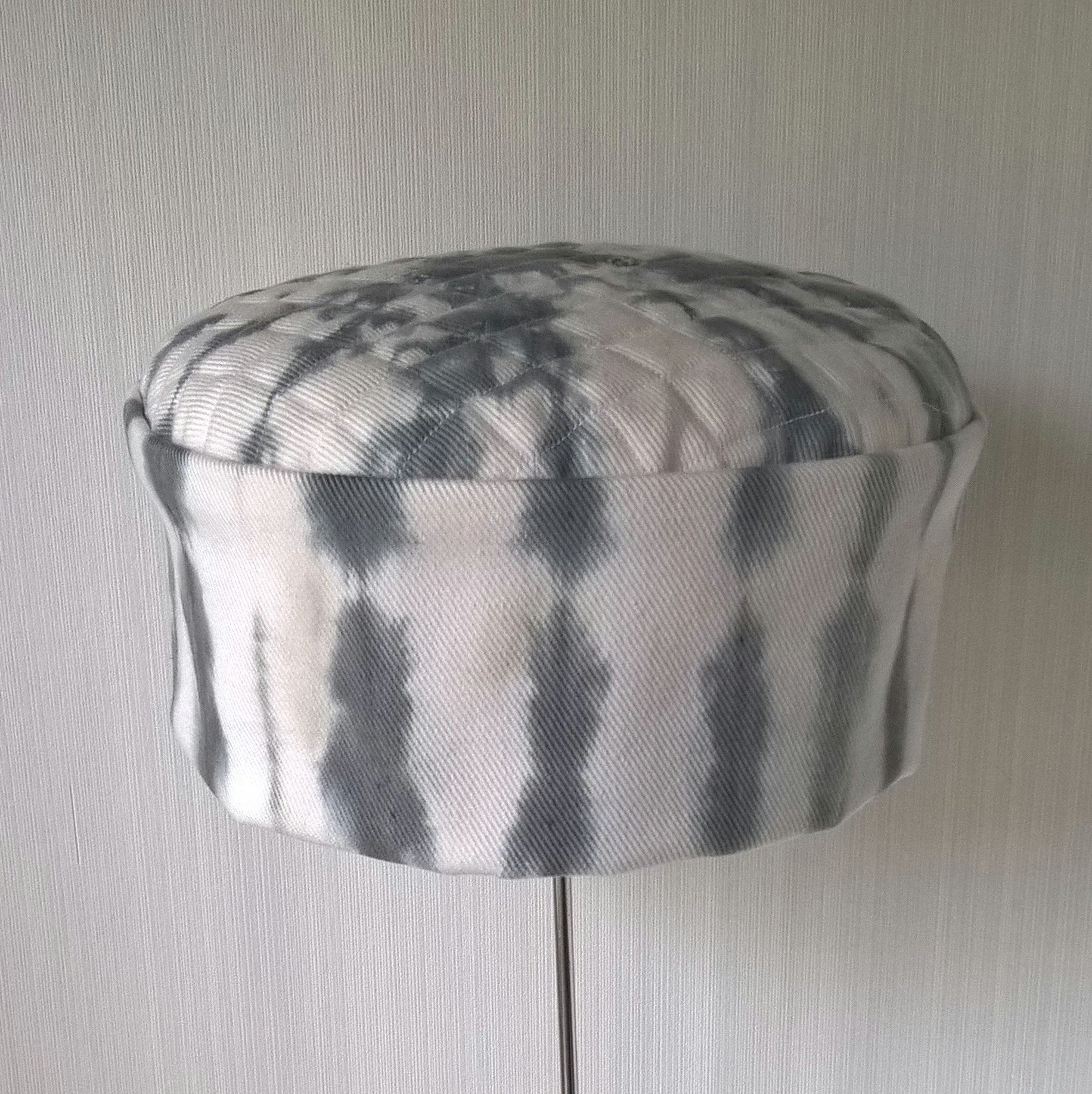 Front view of white cap with black shibori tie dye