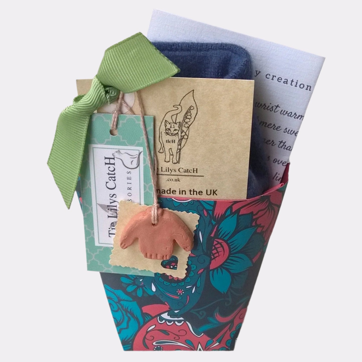 The wrist warmers are gift wrapped in a patterned or plain traditional origami festival cup