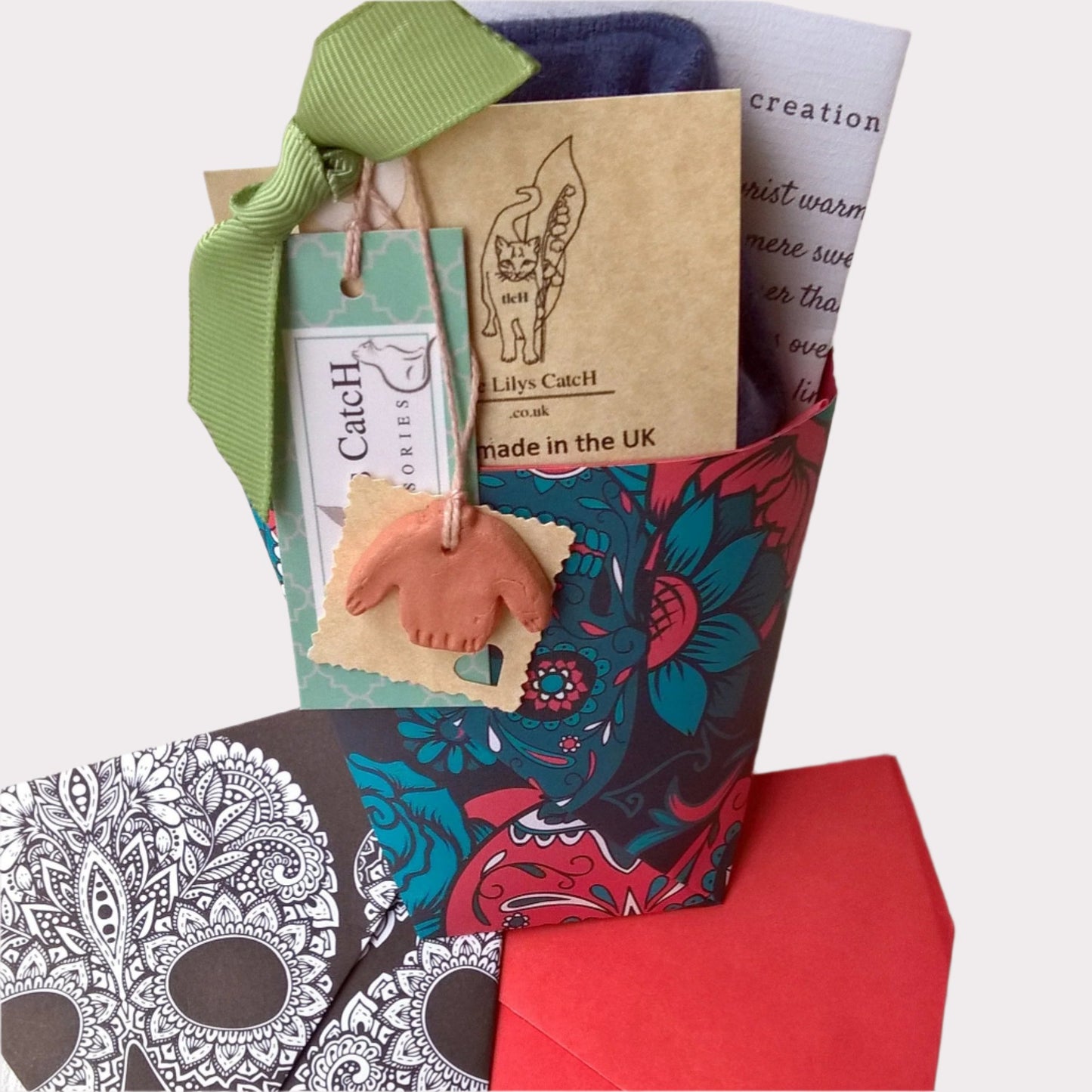 The wrist warmers are gift wrapped in a traditional festival cup