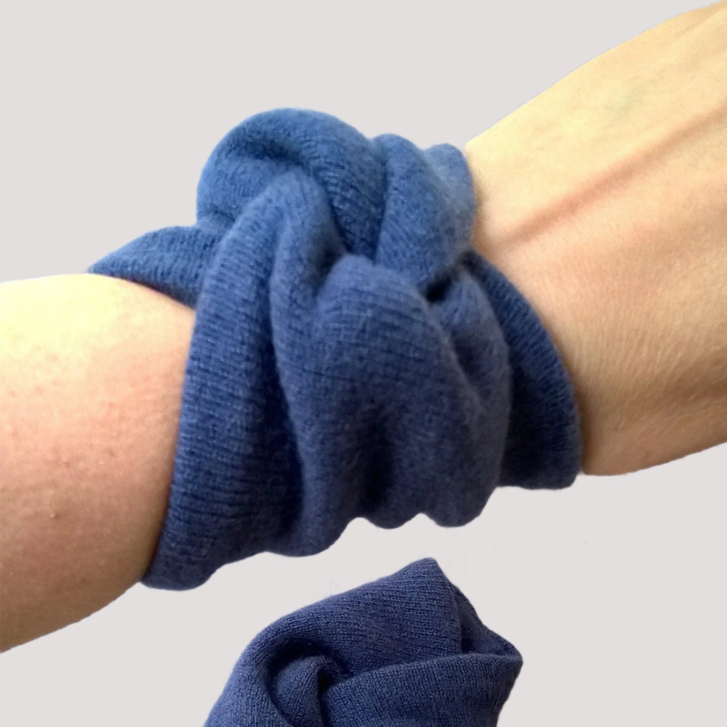 Spruce blue pure cashmere wrist warmers being worn