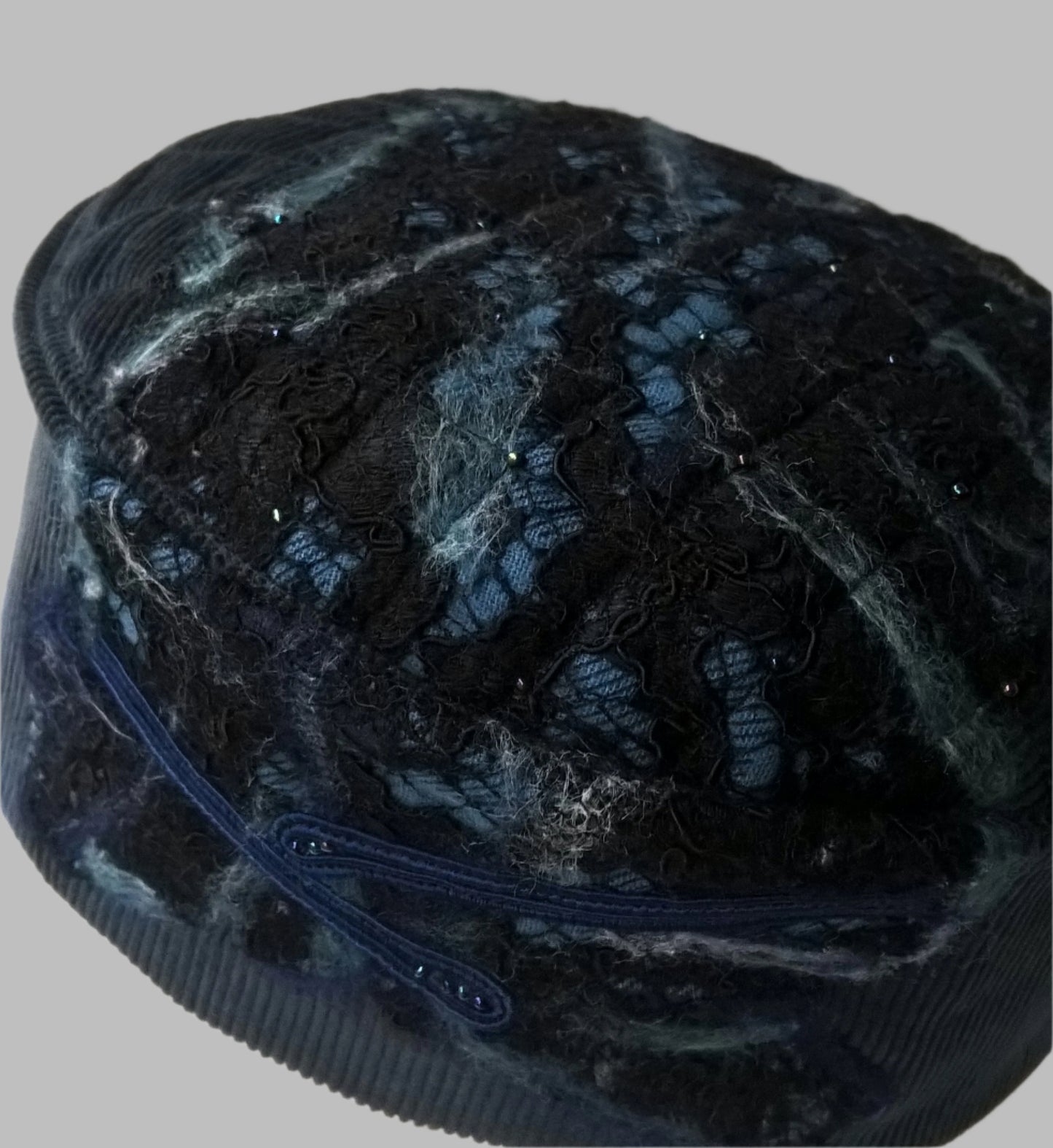 Blue corduroy smoking cap with nuno felting detail to tip and crown
