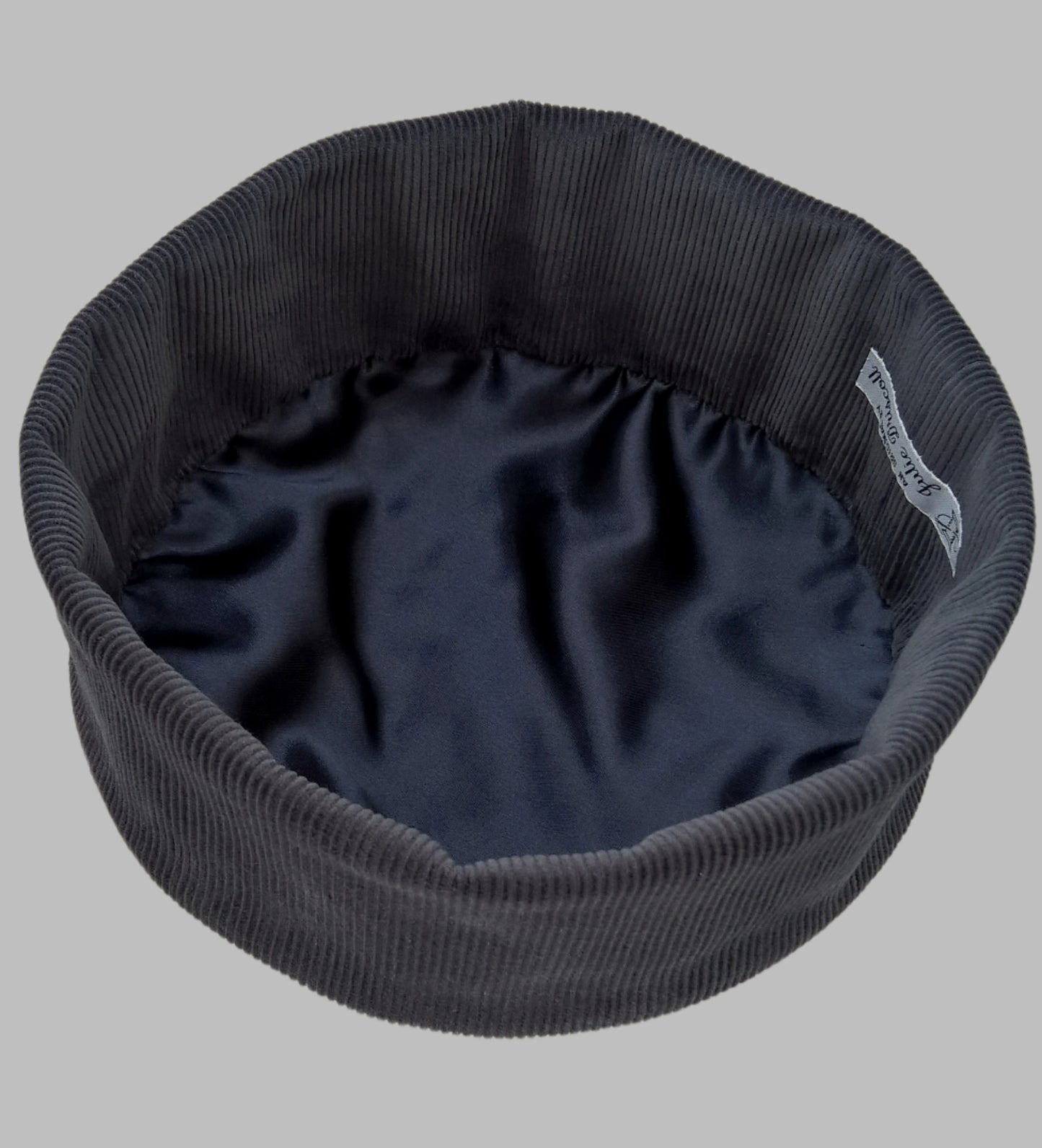 The smoking cap has a satin lining