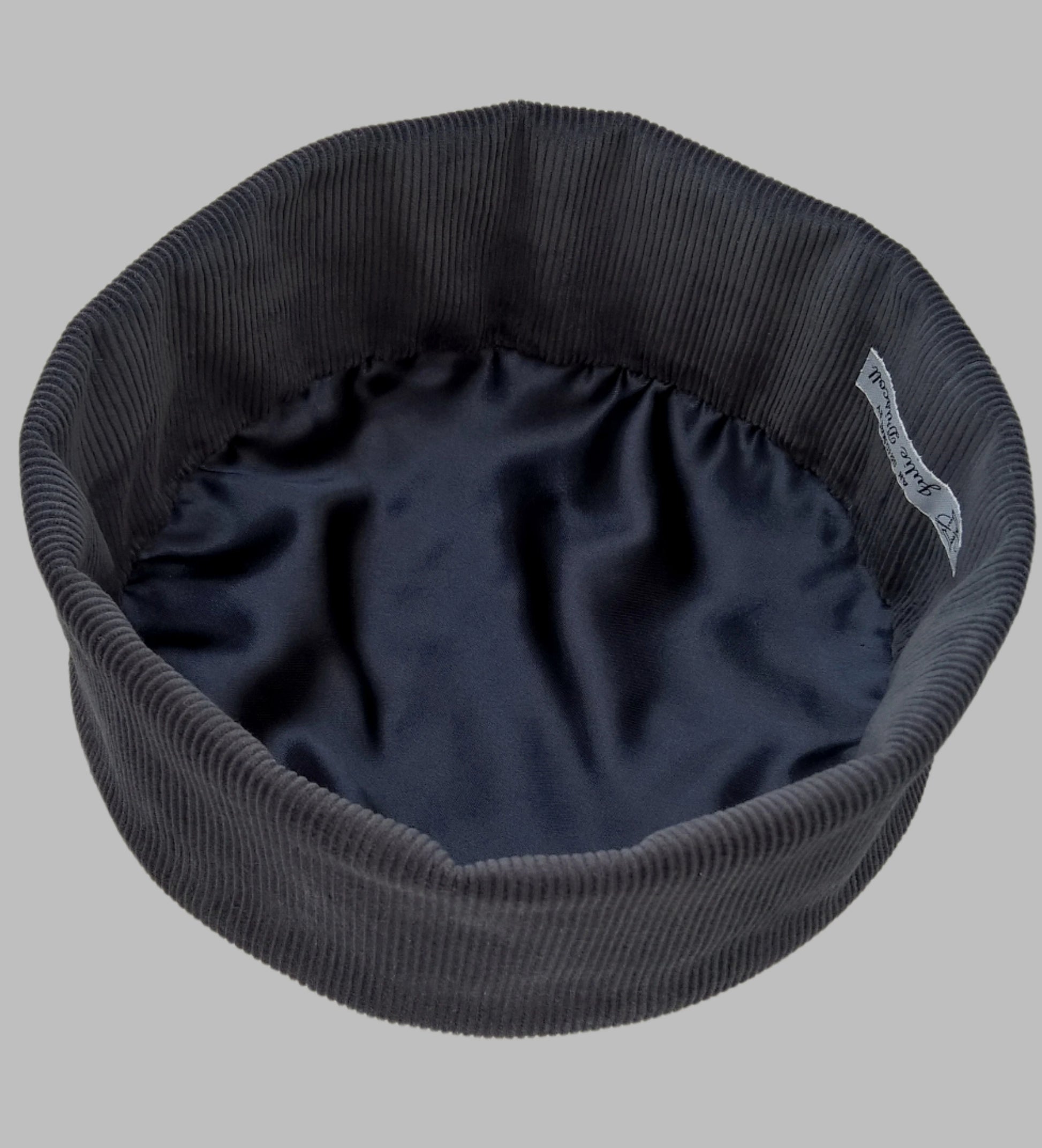 The smoking cap has a satin lining