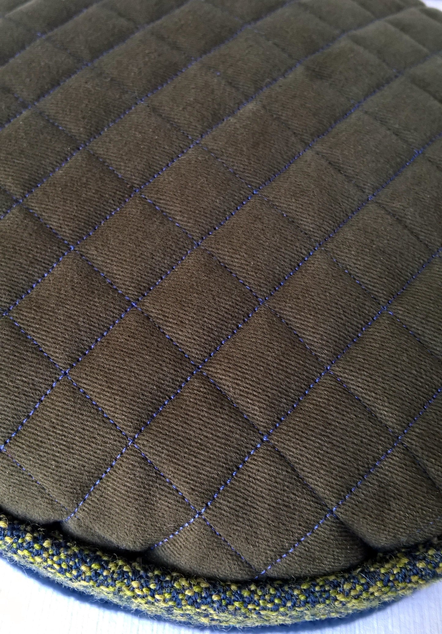 Green and navy fleece hat with quilted tip in contrast stitching